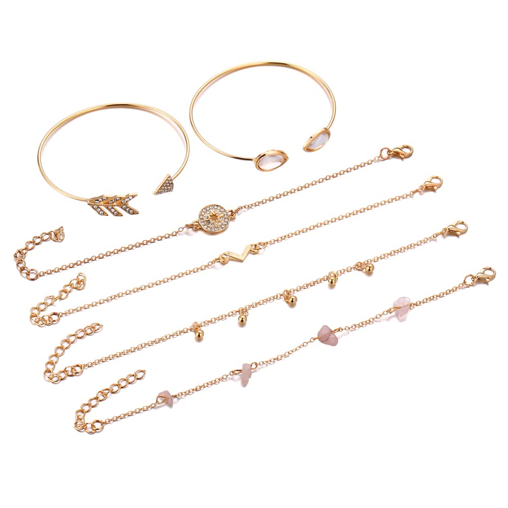 Set of gold necklaces with various pendants on a white background