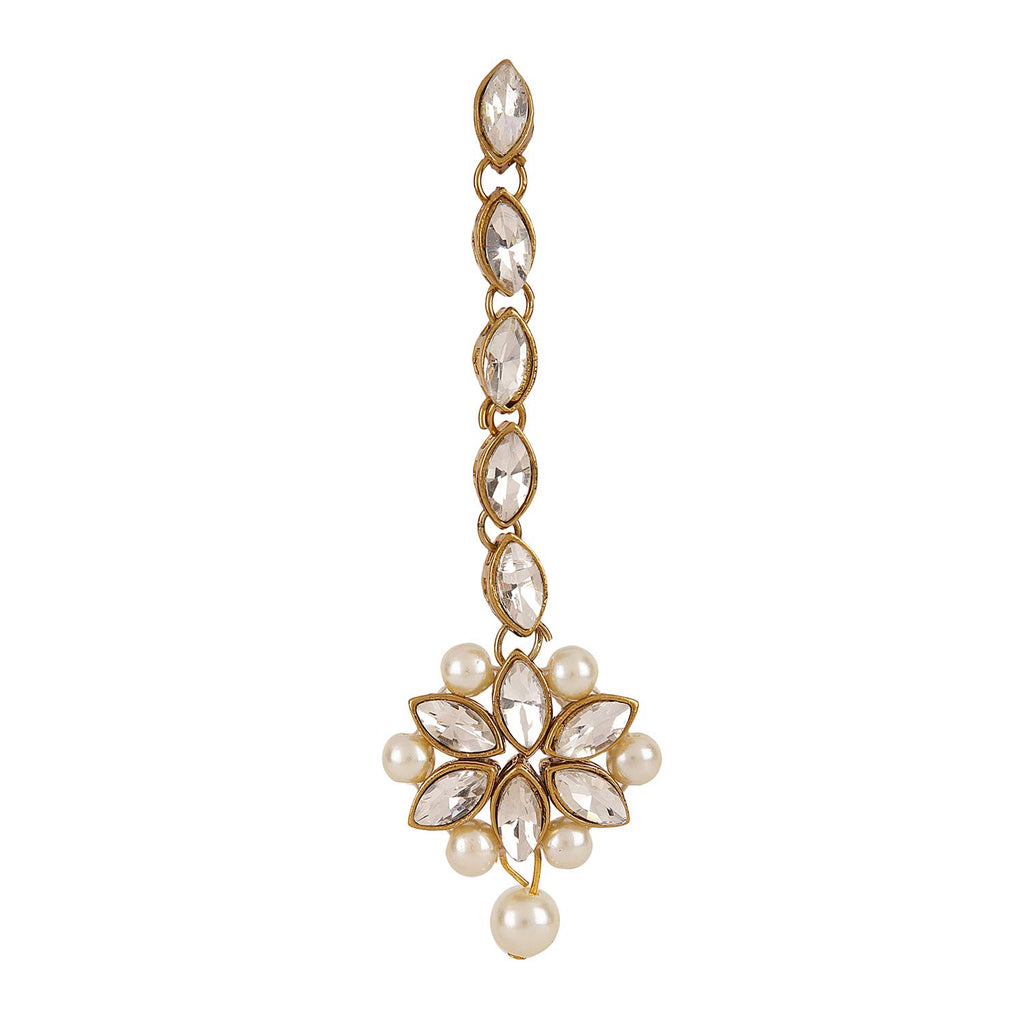 Gold and pearl earring on a white background