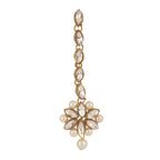 Gold and pearl earring on a white background
