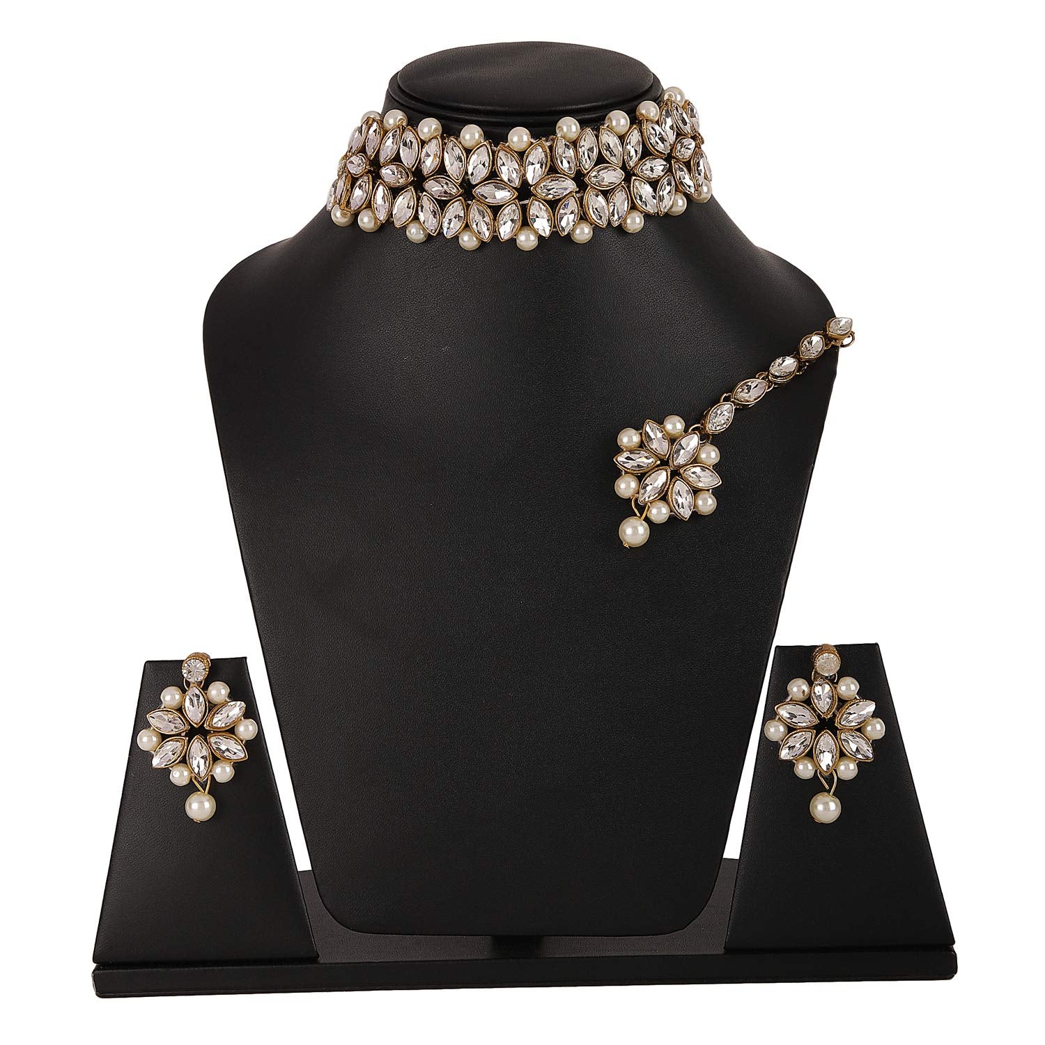 Jewelry set with necklace, earrings, and ring on a black stand against a white background