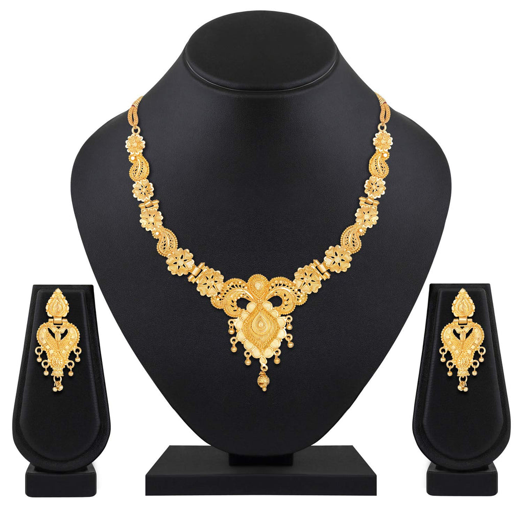 Gold necklace and earrings set on a black mannequin and stands with a white background