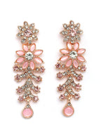 Pair of floral earrings with pink accents and rose gold details on a white background