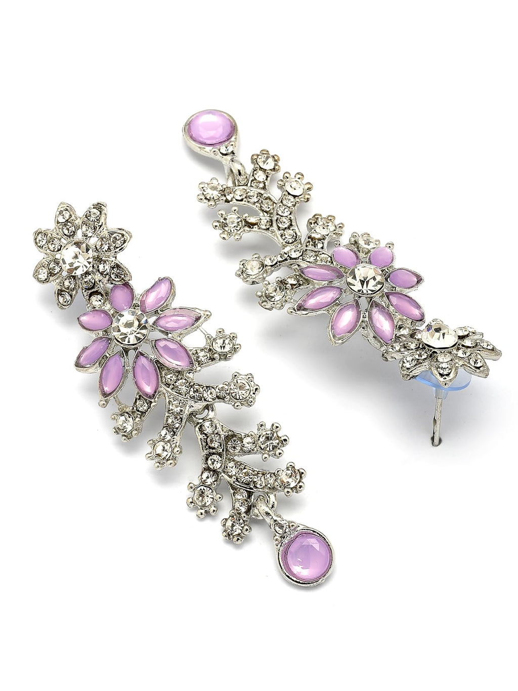 Pair of floral earrings with pink gemstones on a white background