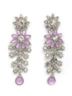 Pair of floral earrings with pink petals and silver accents on a white background