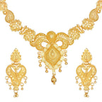 Gold necklace and earrings set on a white background