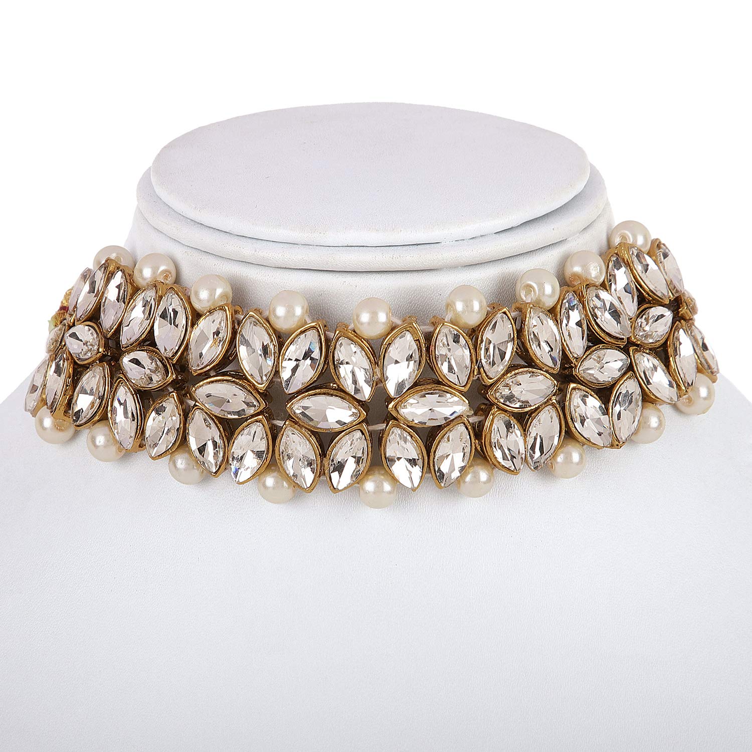 Elegant choker necklace with pearls and crystals on a white stand