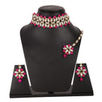 Jewelry set with necklace, earrings, and ring on a black mannequin bust.