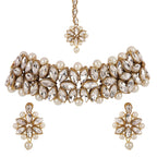 Jewelry set with necklace, earrings, and ring on a white background
