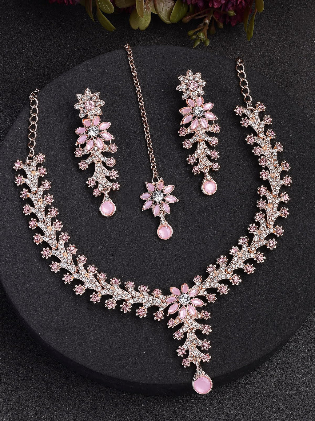 Jewelry set with necklace and earrings on a dark background