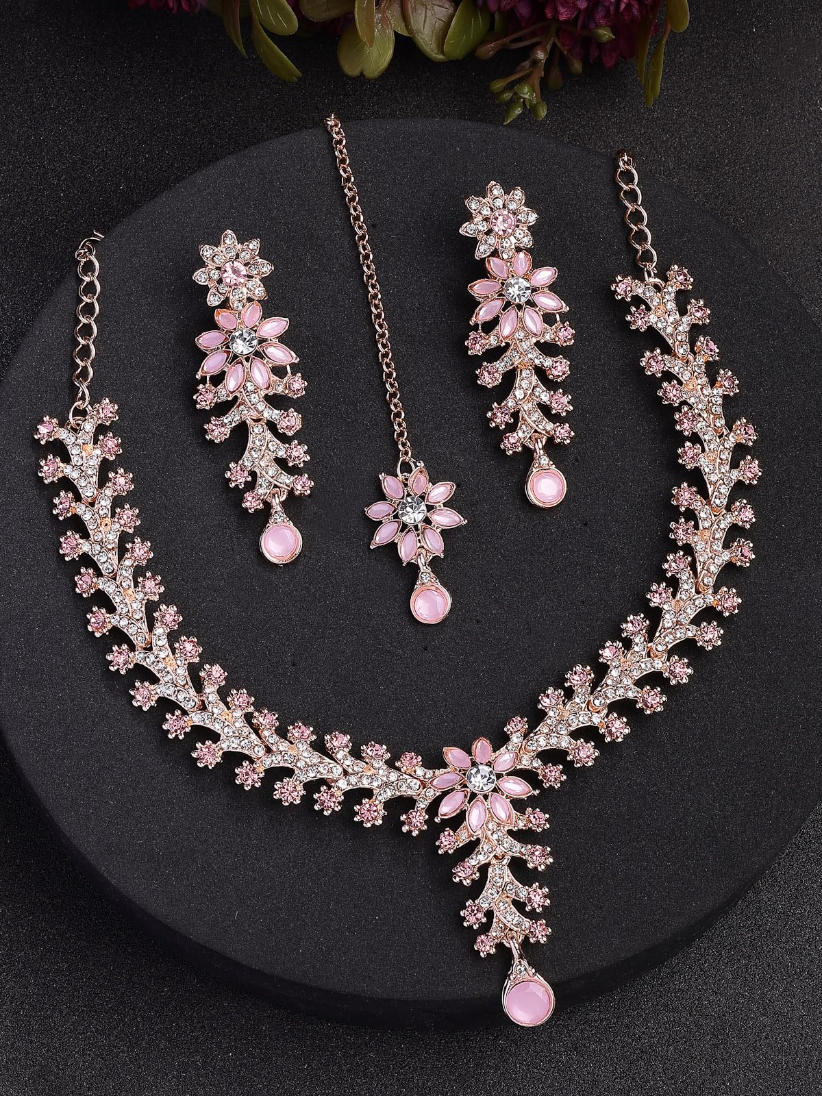 Jewelry set with necklace and earrings on a dark background